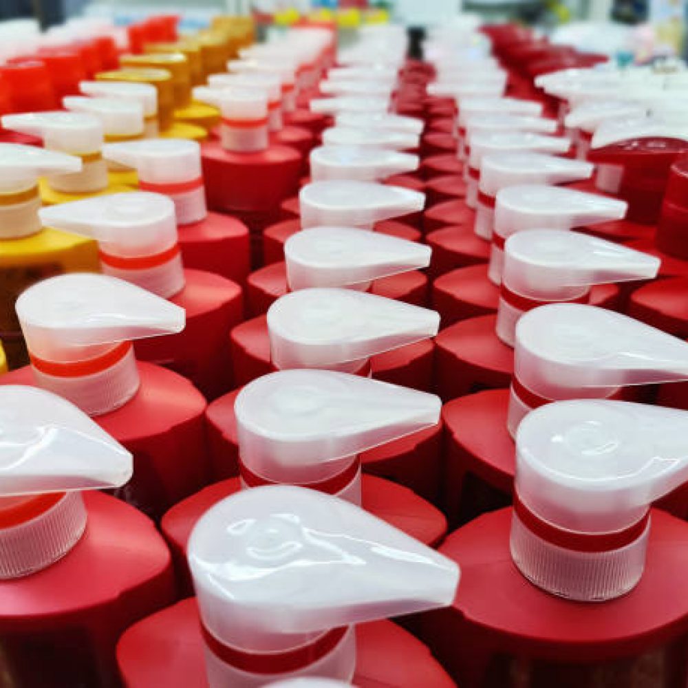 High Angle View of Group of Shampoo Bottles with Dispensing Caps for Sale