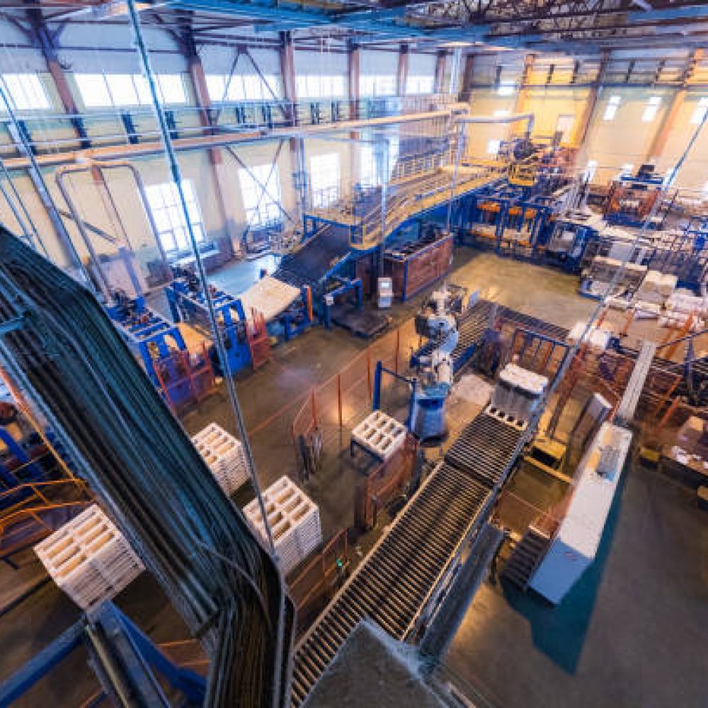 Top view of modern operational plant producing fiberglass heavy industry machinery metalworking workshop concept.